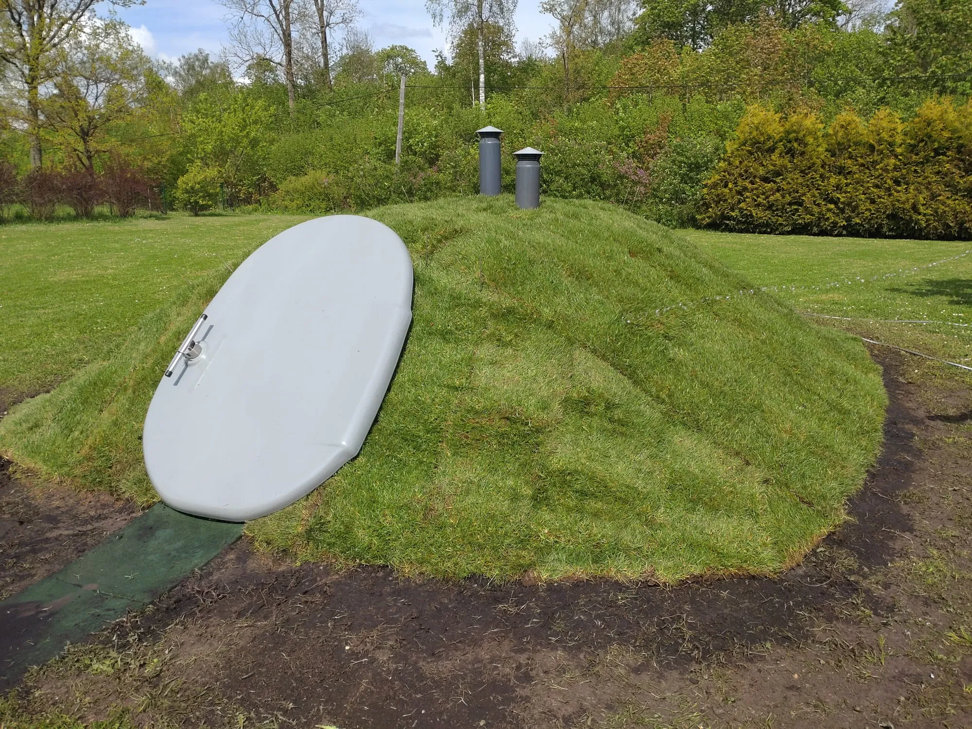 A cellar installed by Pagrabu Eksperti in Mālpils with the lawn restored